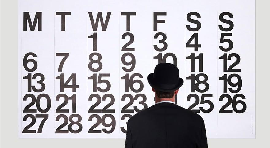 man looking at a calendar
